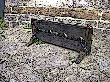 The-stocks-Wooden-Stocks-outside-Cerne-Abbas-church Picture
